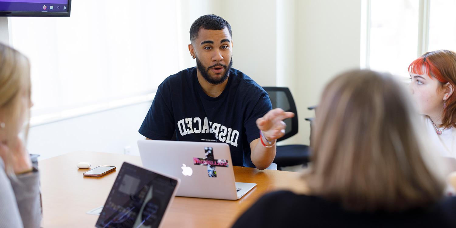 Male Student In Classroom Discussion